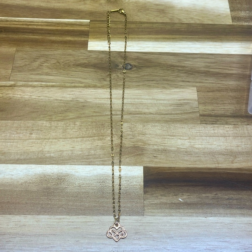 gold necklace with heart intertwined infinity symbol